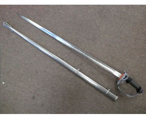 A German infantry sword with an ebonised handle and pierced knuckle guard, the blade inscribed 'Mit Gott Fur Kaiserreich'&nbs