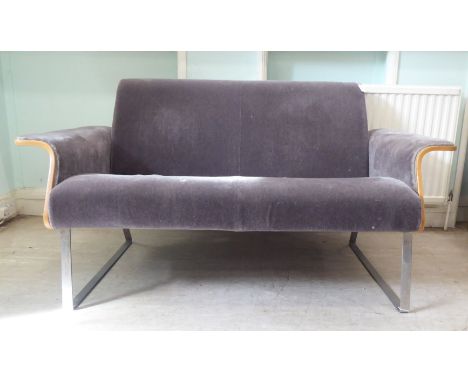 A Robin Day AV2 laminate two person settee, upholstered in a charcoal coloured fabric, raised on chromium legs&nbsp; 