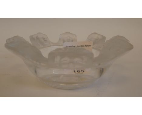 A Lalique part-frosted crystal ashtray 'St Nicholas' with eight cherubic faces&nbsp; bears an etched Lalique, France signatur