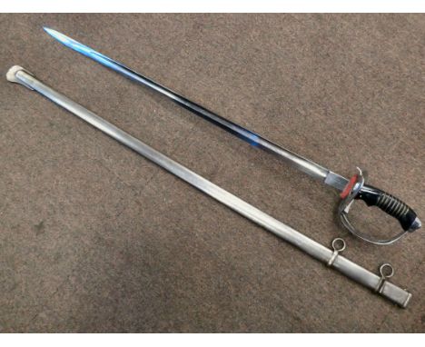 A German infantry sword with an ebonised handle, a pierced knuckle guard and an engraved blade&nbsp; 28.5"L in a scabbard (Pl