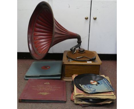 A vintage Edison Bell light oak cased tabletop, wind-up gramophone with a speed regulator, a maroon painted and decoratively 