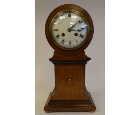 An Edwardian string inlaid mantel clock of tower form, on a plinth and bun feet; the movement faced by a Roman dial&nbsp; 13"