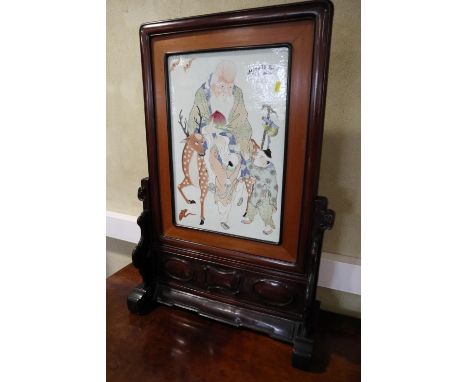 A Chinese porcelain panel fire screen, depicting Laotsu on a deer with acolytes, in hardwood frame, 23 1/2" wide x 34" highCo