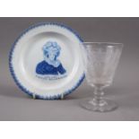 An early 19th century blue and white decorated plate, "Long live Caroline Queen of England", 7 1/