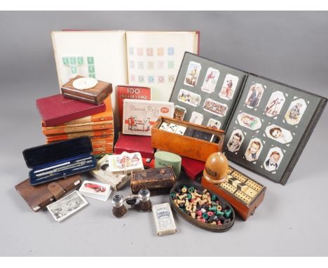 An assortment of ephemera, including playing cards, cigarette cards, stamps, various Penguin books, a Mauchline ware box, a d