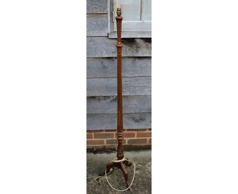 A carved mahogany standard lamp, on tripod splay supports, and two other standard lamps 