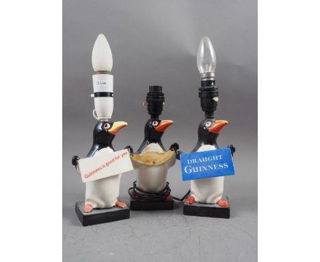 Three Carltonware Guinness Penguin advertising table lamps, 9 1/2" high (one with missing sign) 