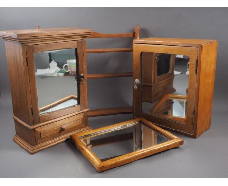 Two pine bathroom cabinets enclosed mirror doors, a pine framed wall mirror, plate 8" x 11", and a fruitwood open wall shelf,