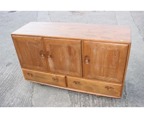 A 1960s Ercol elm 429 sideboard, fitted three doors over two drawers, 52" wide x 18" deep x 30" high 