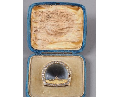 A yellow metal brooch, formed as the Mersey tunnel, engraved to the back "In commemoration of the opening of the Mersey Tunne