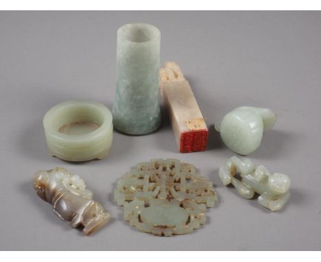 A Chinese pale jade roundel with pierced and engraved decoration, 2 1/4" dia, a hardstone seal, a carved jade reclining figur