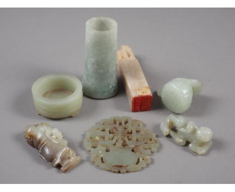 A Chinese pale jade roundel with pierced and engraved decoration, 2 1/4" dia, a hardstone seal, a carved jade reclining figur