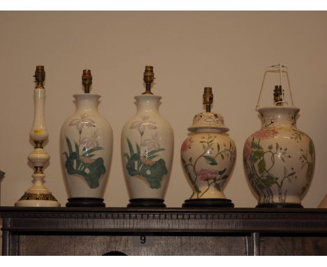 A white marble and brass mounted table lamp, 17 1/4" high overall, a pair of table lamps and two similar table lamps 