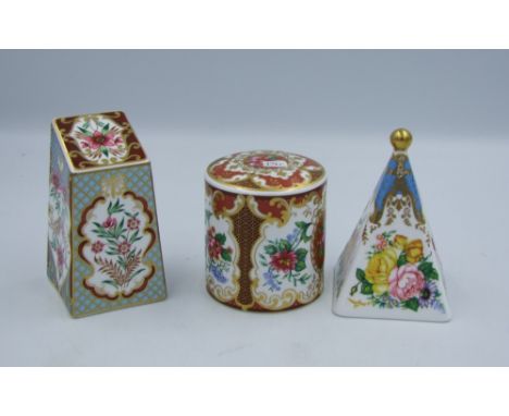Three floral Spode paperweights with gold stoppers. 