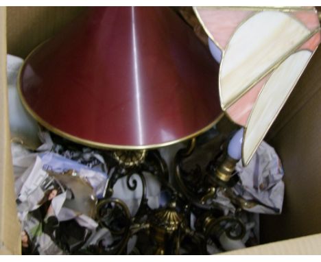 A collection of brass and glass light fittings and shades. 