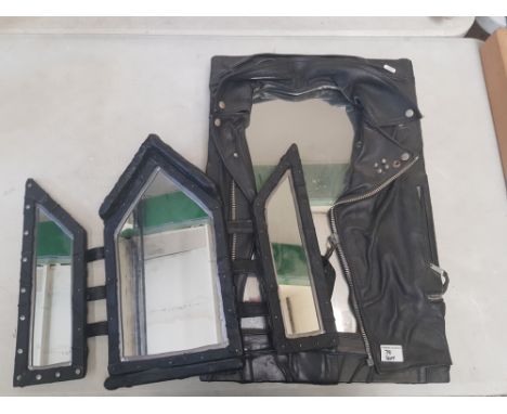An artist made mirror clad in vintage leather jacket together with a tri pane similar mirror 