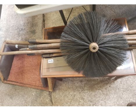 Two artist made leather clad dog beds together with a vintage teak and glass nest of 3 tables and chimney sweep set of brushe