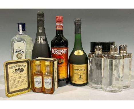A bottle of Bombay Dry Gin; others, Dubonnet, Imperial Brandy, Freixenet Cordon Negro, two miniature bottles of Southern Comf