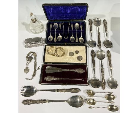 A pair of silver napkin rings, Birmingham 1930; a set of six silver teaspoons, Birmingham 1896; a set of four silver Apostle 