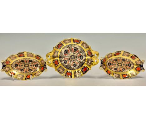 A Royal Crown Derby Imari palette 1128 pattern pedestal bon-bon dish, solid gold band, pair of scroll handles, 16cm across ha