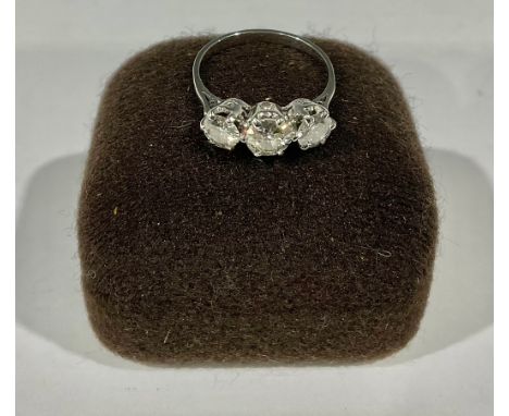 An unmarked white gold three stone diamond ring, the central stone approx. 0.5ct, flanked by two further, approx. 0.3ct stone