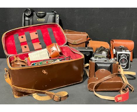 Cameras - a Donata concertina camera, brown leather case; a Ziess Ikon Box Tengor, cased;a Model E Brownie  six-20 camera, ca