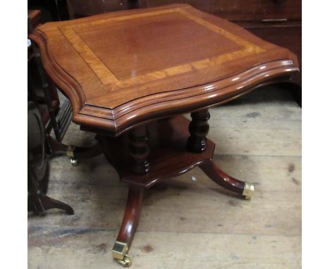 Small reproduction mahogany shaped square inlaid lamp table with undertier, having splayed supports with brass caps and caste