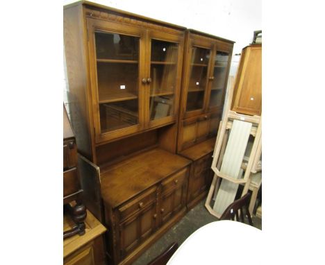 Pair of 20th Century Ercol medium elm bookcases, one with fall front bureau 