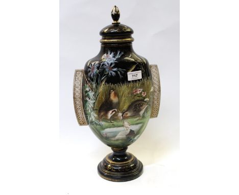 19th Century black glass enamel and painted two-handled vase with cover, decorated with birds in a landscape (repair to foot)