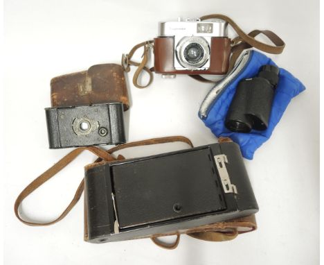 Voigtlander 35mm camera, together with two bellows cameras and a monocular 