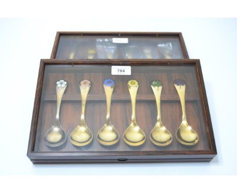 Group of twelve Georg Jensen silver gilt spoons, circa 1970's, the handles enamel decorated with flowerheads, each spoon 1.45