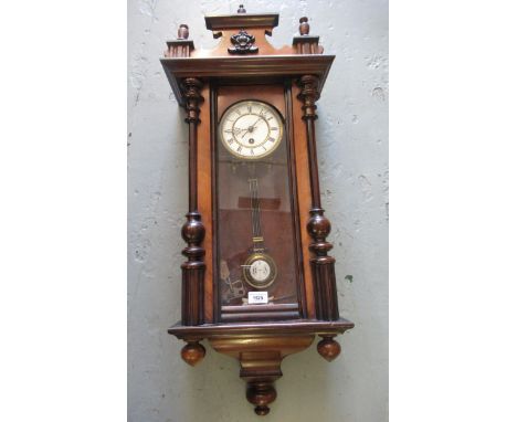 Late 19th / early 20th Century walnut Vienna style wall clock, the enamel dial with Roman numerals and single train movement,