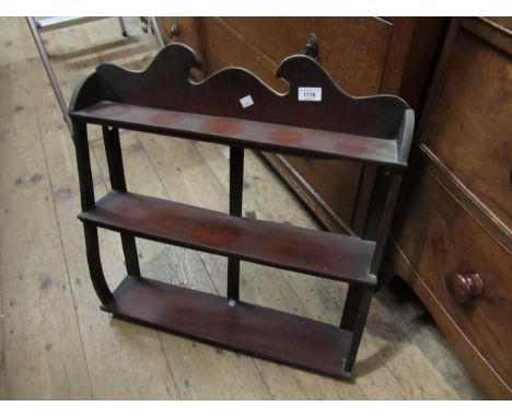 Edwardian mahogany three shelf wall bracket, 65cm high x 60cm wide x 13cm deep, together with an oak four shelf wall bracket 