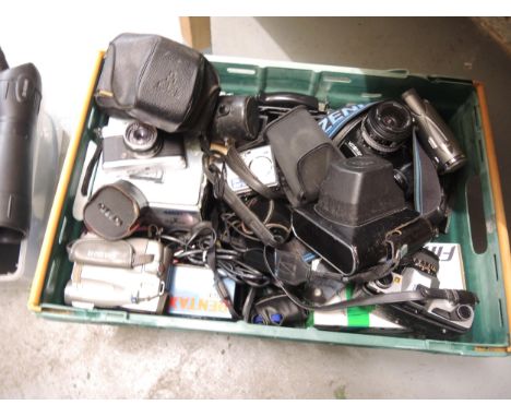 Collection of various camera lenses, including a Steinhell, Helios wide angle lens, a Russian compact mirror lens, together w