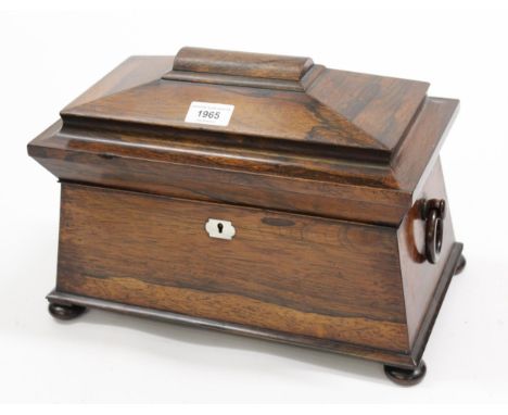 19th Century rosewood sarcophagus shaped tea caddy with a hinged cover enclosing a three division interior with blending bowl
