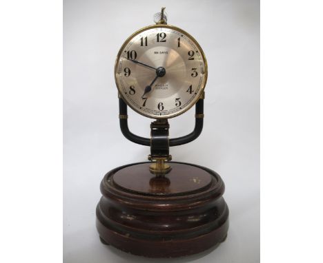 Early 20th Century Bulle 1800 day electric mantel clock by Pinchin Johnson, housed under a glass dome, on a mahogany base, 26