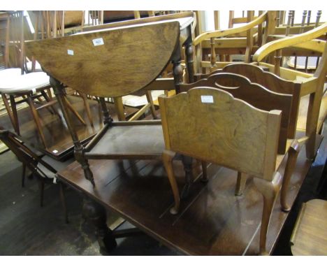 1930's oval oak drop-leaf two tier tea trolley, together with a walnut two division magazine rack on cabriole supports and a 