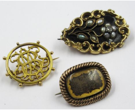 19th Century gold and black enamel memorial brooch set seed pearls and a diamond, together with a gold hair inset brooch and 