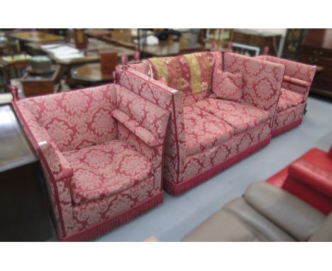 Knole type three piece sitting room suite covered in a red damask fabricThe sofa does drop at either end. 