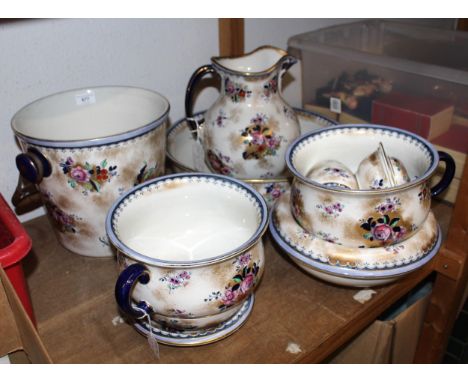 Losolware jug and basin with gilt and floral decoration, together with other similar pieces of the same makeBucket with wicke