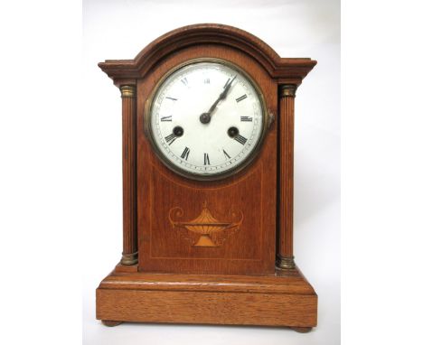 Edwardian oak and inlaid two train mantel clock with an architectural case, together with a small lancet shaped mantel clock 