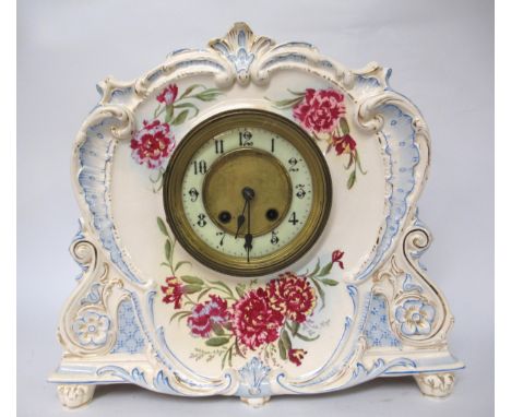 Royal Bonn floral decorated pottery mantel clock with a two train movement 