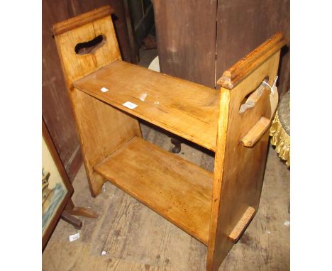 Arts and Crafts oak two shelf bookrack, 70cm high x 30cm deep and a small ebonised octagonal two tier table with pierced supp