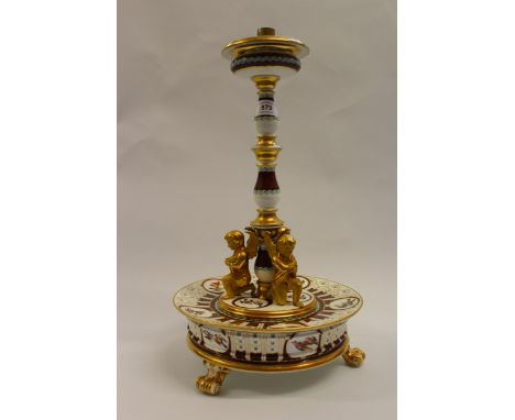 20th Century Continental porcelain table lamp base, mounted with figures of winged cherubs, having hand painted decoration of