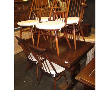 Mid 20th Century Ercol dining room suite, comprising a set of eight (six plus two) stickback chairs, a refectory style draw-l