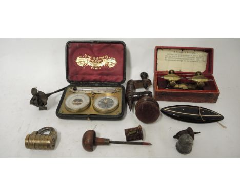 Bag containing a small quantity of various items including a turned wooden sewing clamp, brass combination lock, cased compas
