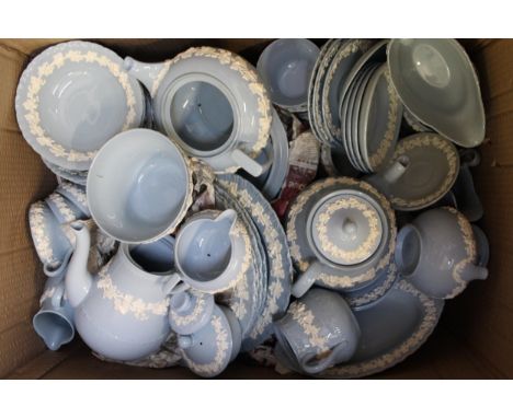 An extensive Wedgwood Queensware dinner and tea service decorated with floral garlands on a pale blue groundChip to spout and