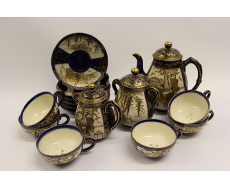 Japanese Satsuma pottery coffee service decorated with panels of figures and landscapes on a blue ground comprising ; coffee 