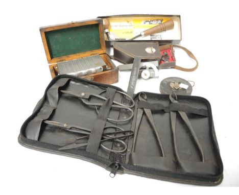 Black japanned and silvered metal level housed in a leather case, together with a quantity of various engineering and other t