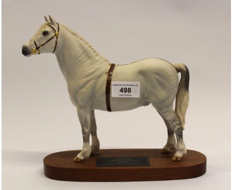Beswick connoisseur model of ' Champion ', Welsh mountain pony, matt glazed and mounted on an oval mahogany plinth, 22.9cm hi